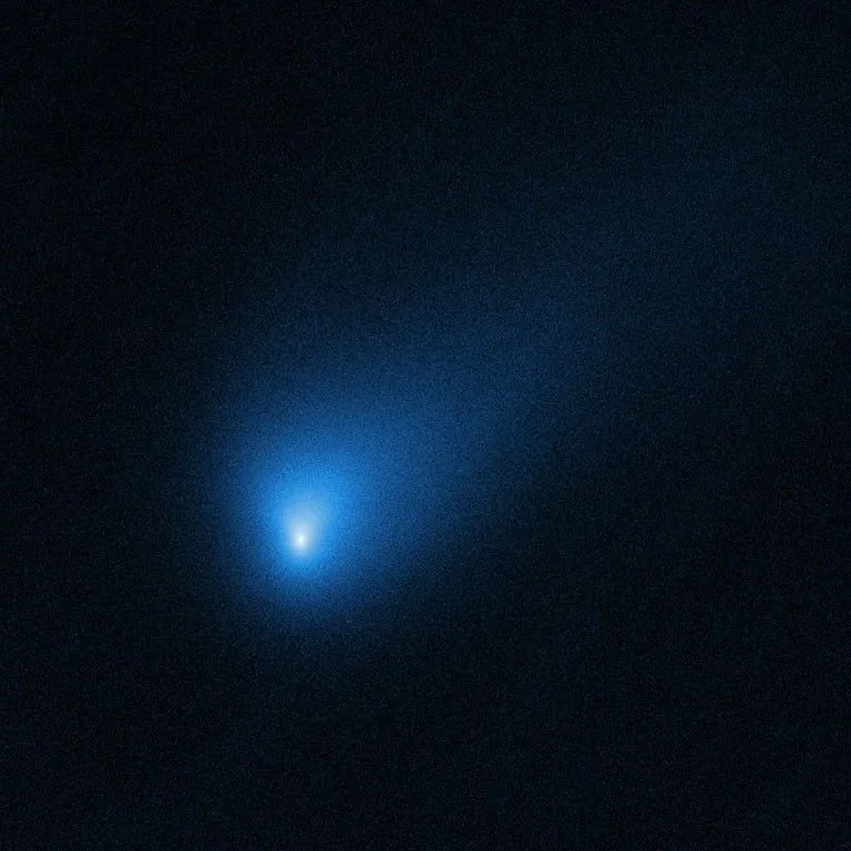 Figure Hubble Space Telescope image of interstellar Comet 2IBorisov in October 2019, about 418 million km from Earth. The bright nucleus is surrounded by a bluish coma of gas and dust (NASAESA, image credit D. Jewitt).